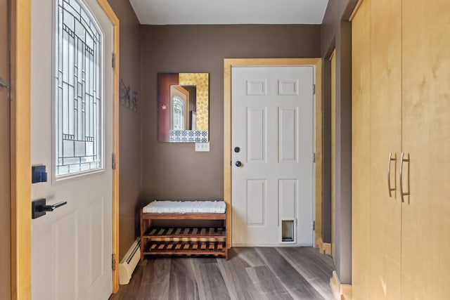 56 Old Kings Hwy, Ogunquit, ME 03907 - doorway to outside featuring dark wood-type flooring and a baseboard heating unit