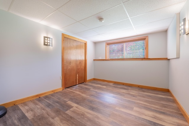 56 Old Kings Hwy, Ogunquit, ME 03907 - empty room with baseboards, a drop ceiling, and wood finished floors