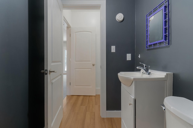 56 Old Kings Hwy, Ogunquit, ME 03907 - half bathroom with vanity, toilet, and wood finished floors