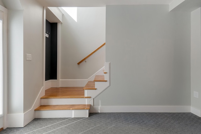 56 Old Kings Hwy, Ogunquit, ME 03907 - stairway featuring a healthy amount of sunlight, baseboards, and carpet
