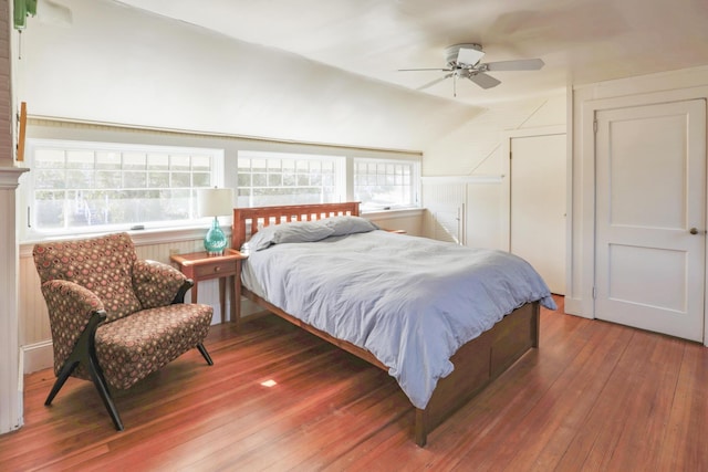bedroom featuring vaulted ceiling, hardwood / wood-style floors, and ceiling fan
