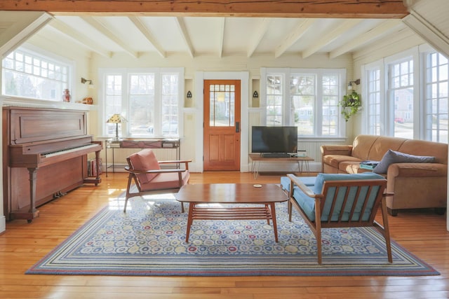 interior space with beam ceiling and light wood-type flooring