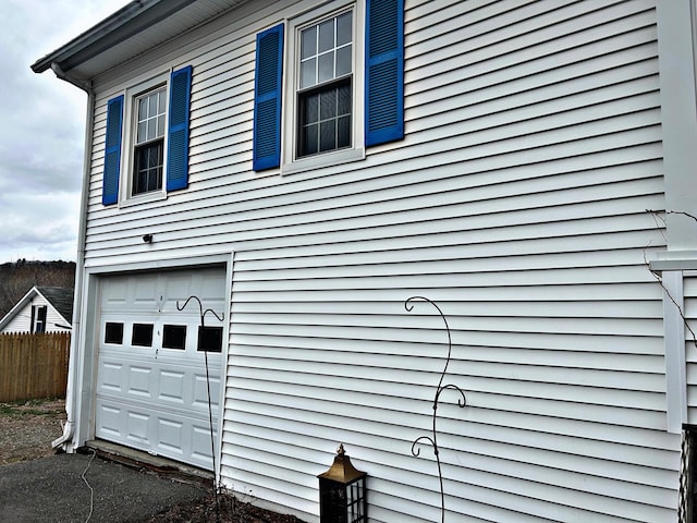 106 Northern Ave, Augusta, ME 04330 - view of home's exterior with fence and a garage