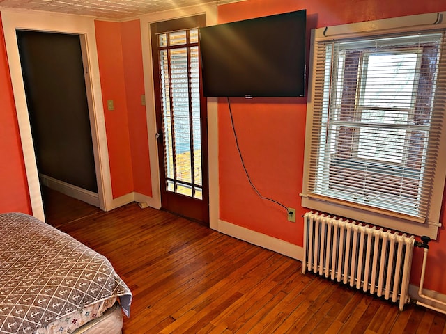 106 Northern Ave, Augusta, ME 04330 - bedroom with radiator, baseboards, ornamental molding, and hardwood / wood-style flooring