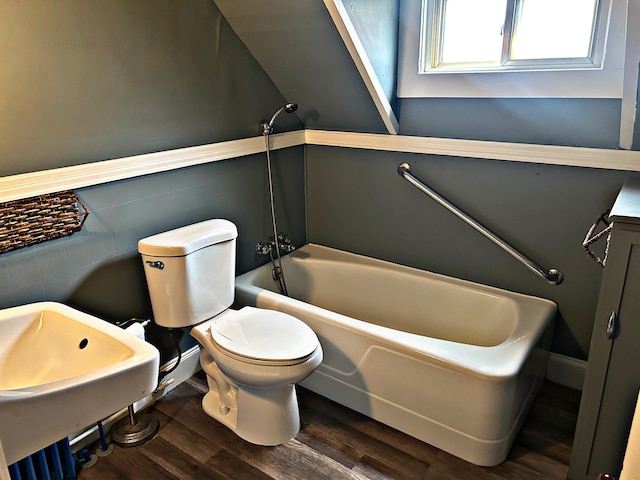 106 Northern Ave, Augusta, ME 04330 - bathroom with tile walls, toilet, wood finished floors, and tub / shower combination