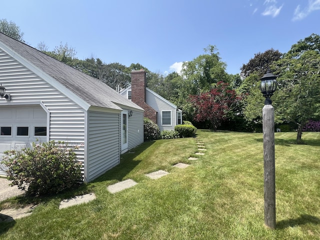 270 Meadowlark Vlg Unit 305, Ogunquit, ME 03907 - view of green lawn with a garage