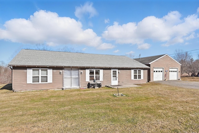 ranch-style house featuring an attached garage, a front lawn, aphalt driveway, and roof with shingles