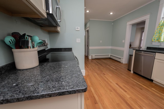 369 Ohio St, Bangor, ME 04401 - kitchen featuring stainless steel appliances, light wood-type flooring, ornamental molding, white cabinetry, and recessed lighting
