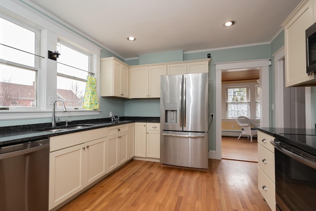 369 Ohio St, Bangor, ME 04401 - kitchen with appliances with stainless steel finishes, a sink, ornamental molding, light wood-type flooring, and recessed lighting