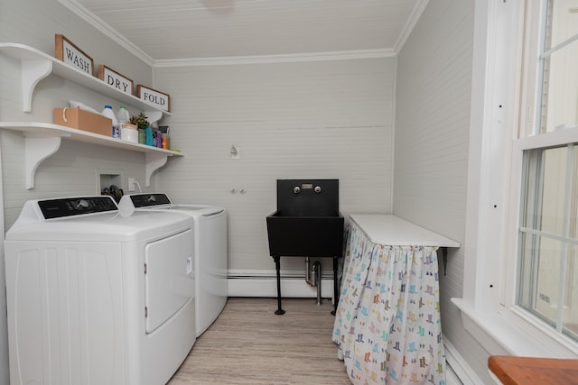 369 Ohio St, Bangor, ME 04401 - washroom featuring separate washer and dryer, ornamental molding, light wood finished floors, and a baseboard radiator