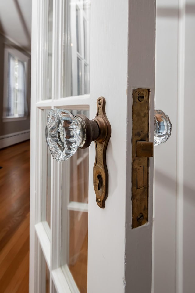 369 Ohio St, Bangor, ME 04401 - detailed view of a baseboard radiator and wood finished floors