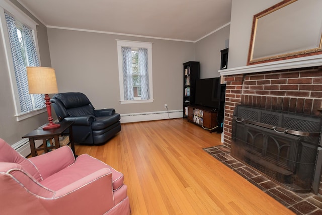 369 Ohio St, Bangor, ME 04401 - living area with a baseboard heating unit, wood finished floors, healthy amount of natural light, crown molding, and baseboards