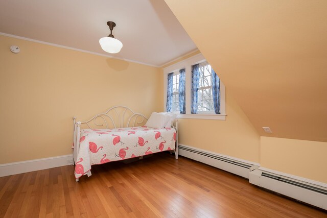 369 Ohio St, Bangor, ME 04401 - bedroom with ornamental molding, wood finished floors, a baseboard radiator, and baseboards