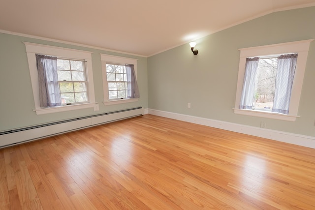369 Ohio St, Bangor, ME 04401 - spare room with ornamental molding, baseboard heating, light wood finished floors, baseboards, and lofted ceiling