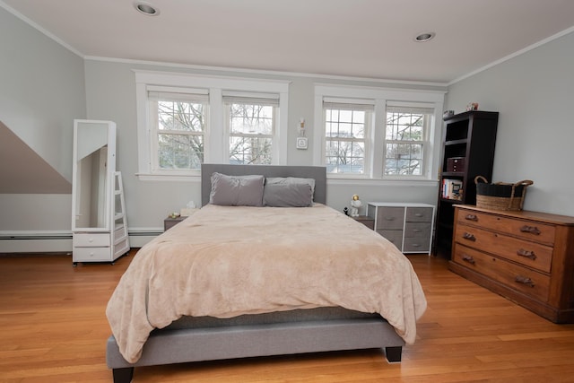 369 Ohio St, Bangor, ME 04401 - bedroom with crown molding, light wood-type flooring, recessed lighting, and a baseboard radiator