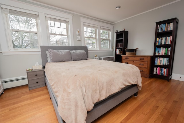 369 Ohio St, Bangor, ME 04401 - bedroom featuring light wood-style flooring, crown molding, baseboard heating, and recessed lighting