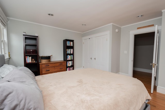 369 Ohio St, Bangor, ME 04401 - bedroom with wood finished floors, ornamental molding, baseboards, recessed lighting, and a closet