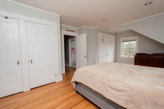 369 Ohio St, Bangor, ME 04401 - bedroom featuring light wood-type flooring, recessed lighting, ornamental molding, two closets, and baseboards