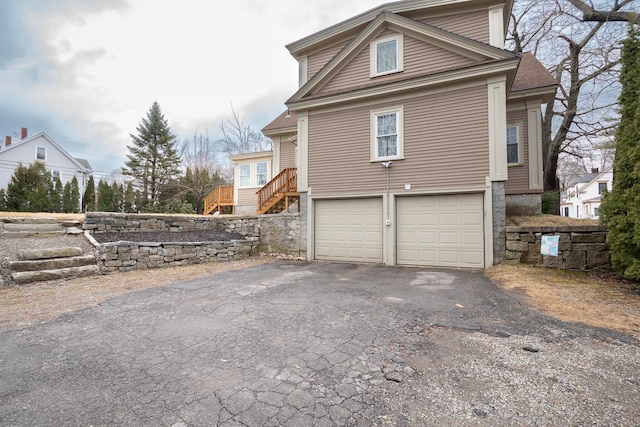 369 Ohio St, Bangor, ME 04401 - view of side of property with stairs, driveway, and a garage