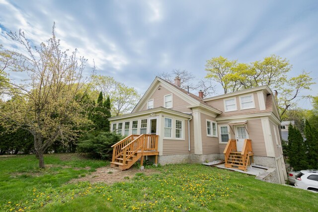 369 Ohio St, Bangor, ME 04401 - rear view of house featuring a chimney and a yard