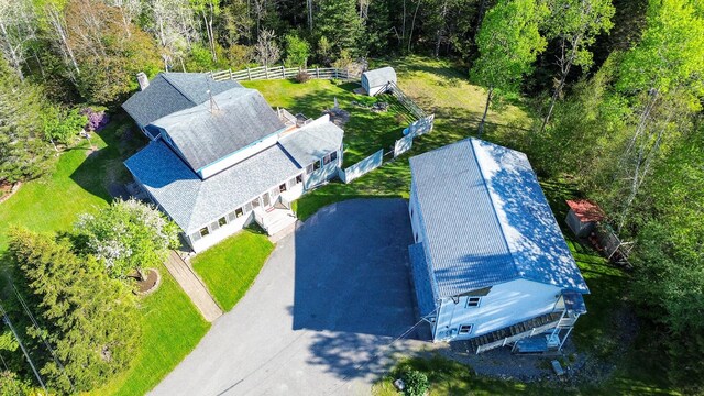 drone / aerial view featuring a view of trees