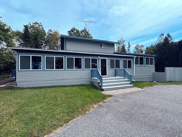 view of front of property with a front lawn