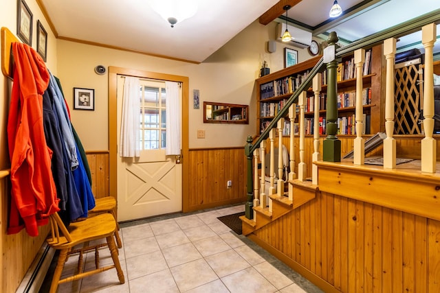 tiled entrance foyer with a wealth of natural light, stairway, wainscoting, and a baseboard heating unit