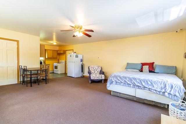 bedroom featuring carpet, freestanding refrigerator, and a ceiling fan