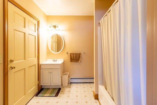 full bathroom featuring tile patterned floors, a baseboard heating unit, and vanity