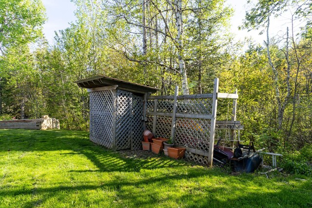 view of outbuilding with a wooded view