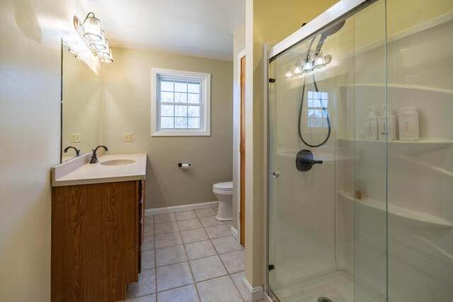 110 Harris Rd, Minot, ME 04258 - full bath with vanity, tile patterned flooring, toilet, a stall shower, and baseboards