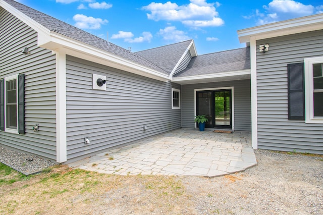 12 Charlies Way, Readfield, ME 04355 - rear view of house with a shingled roof and a patio area