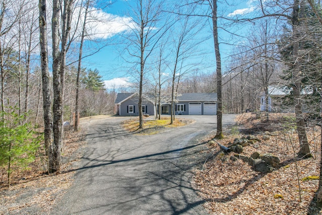 12 Charlies Way, Readfield, ME 04355 - view of front facade with a garage and driveway