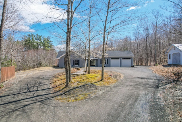 12 Charlies Way, Readfield, ME 04355 - view of front of property featuring fence, an attached garage, and aphalt driveway