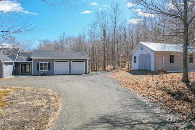 12 Charlies Way, Readfield, ME 04355 - exterior space featuring an attached garage, an outdoor structure, and aphalt driveway