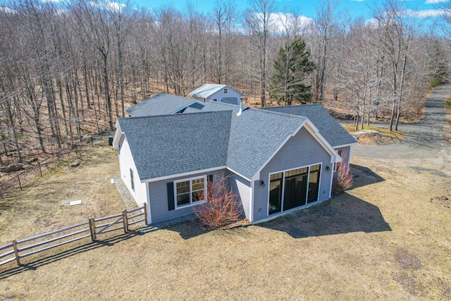12 Charlies Way, Readfield, ME 04355 - back of house featuring a lawn, a shingled roof, and fence