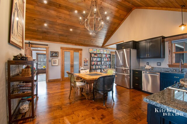 12 Charlies Way, Readfield, ME 04355 - kitchen with dark wood-style floors, dark stone counters, wood ceiling, a sink, and appliances with stainless steel finishes