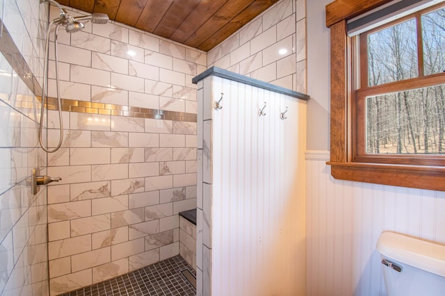 12 Charlies Way, Readfield, ME 04355 - bathroom with toilet, a tile shower, wood ceiling, and a wainscoted wall