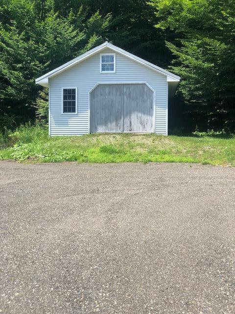 12 Charlies Way, Readfield, ME 04355 - view of outdoor structure with an outbuilding and a wooded view