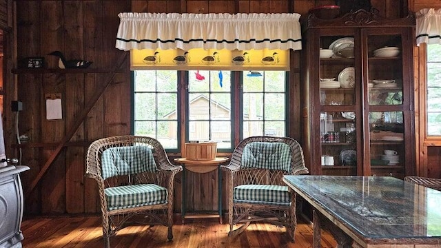 sitting room featuring wood finished floors and a healthy amount of sunlight