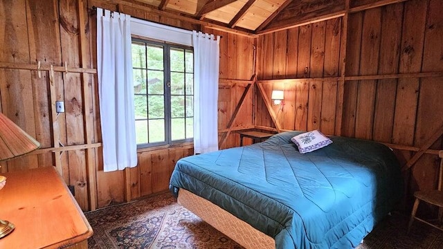 bedroom with lofted ceiling, wood walls, and wooden ceiling