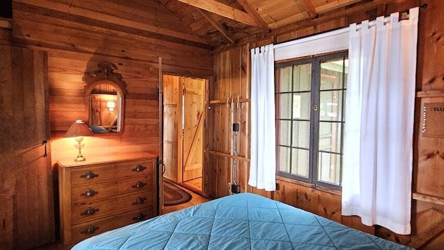 bedroom featuring wooden ceiling, vaulted ceiling with beams, and wooden walls