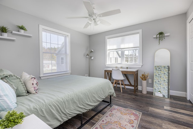 bedroom featuring baseboards, a ceiling fan, and wood finished floors