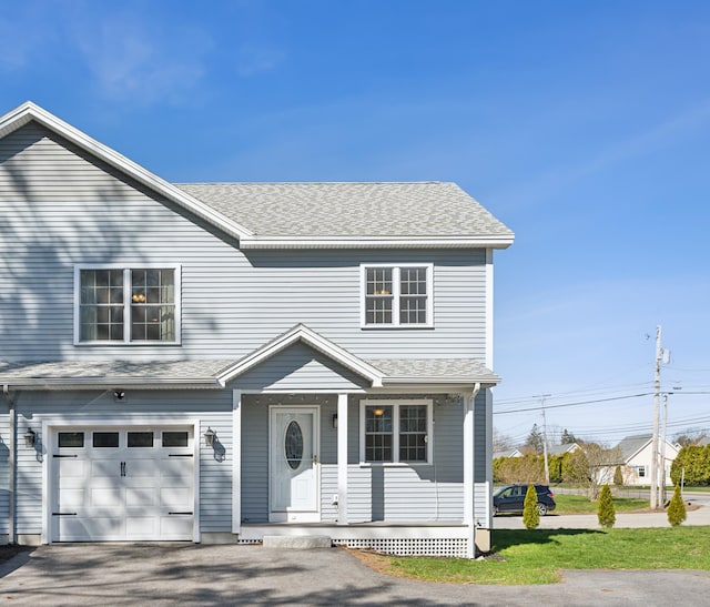 189 Saco Ave Unit 3, Old Orchard Beach, ME 04064 - traditional home featuring a garage, a porch, a shingled roof, and asphalt driveway