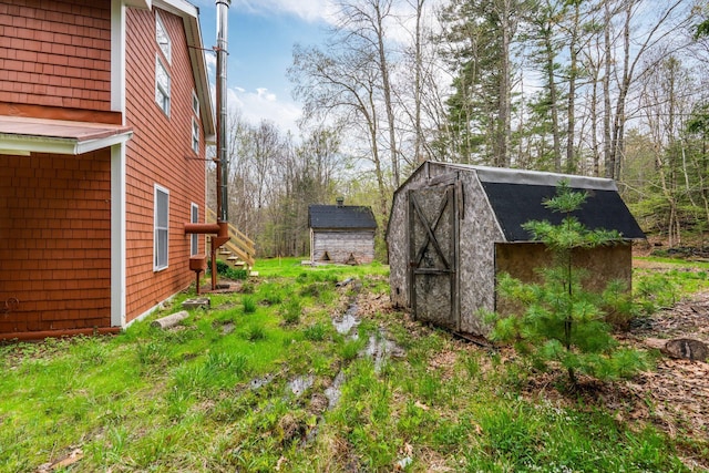 285 Hockomock Rd, Woolwich, ME 04579 - view of yard with a storage unit and an outbuilding