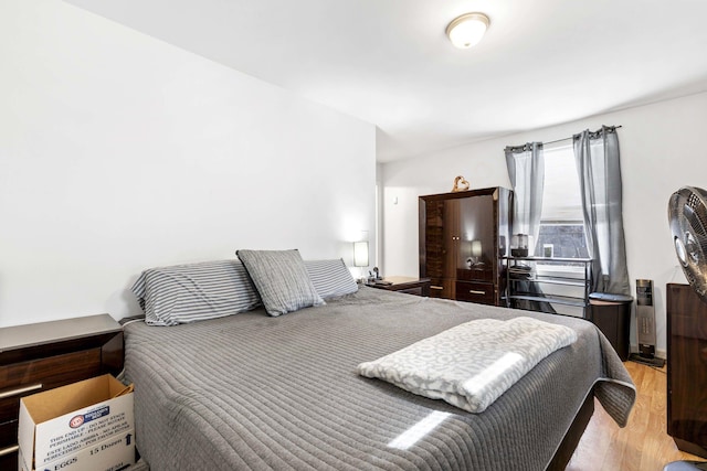 bedroom featuring wood finished floors