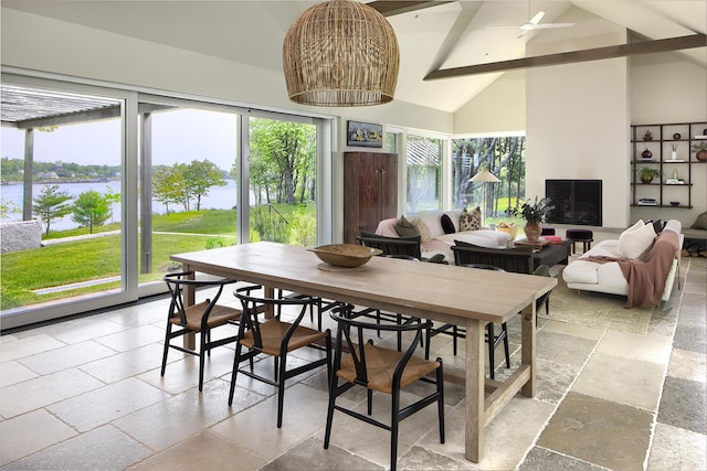 4 Ice House Pt, York, ME 03909 - dining room with stone tile flooring, a water view, beamed ceiling, high vaulted ceiling, and plenty of natural light