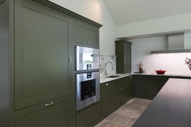 4 Ice House Pt, York, ME 03909 - kitchen featuring a sink, wall chimney range hood, vaulted ceiling, green cabinets, and tasteful backsplash