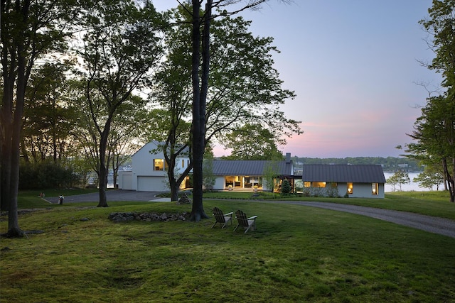 4 Ice House Pt, York, ME 03909 - view of front of property with a garage, driveway, a lawn, and metal roof