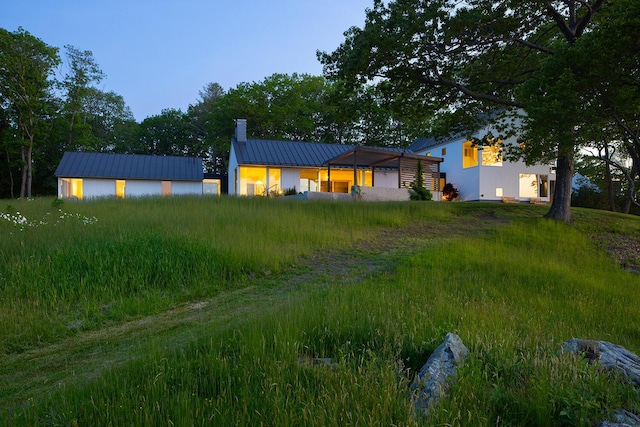 4 Ice House Pt, York, ME 03909 - view of front of property featuring metal roof, a chimney, and a standing seam roof